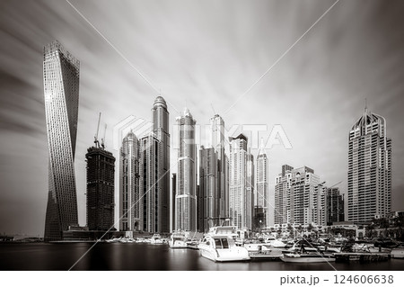 Skyscrapers and bridge over water, black and white style, city background, Dubai Marina bay UAE 124606638
