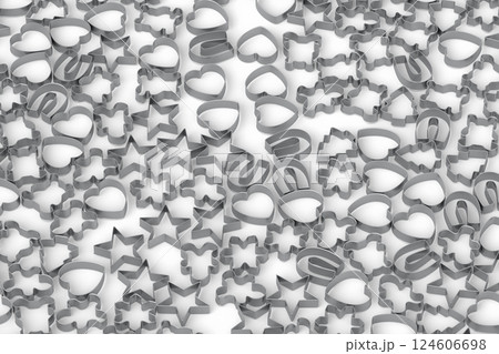 Pile of gleaming metal cookie cutters, featuring various shapes and sizes 124606698
