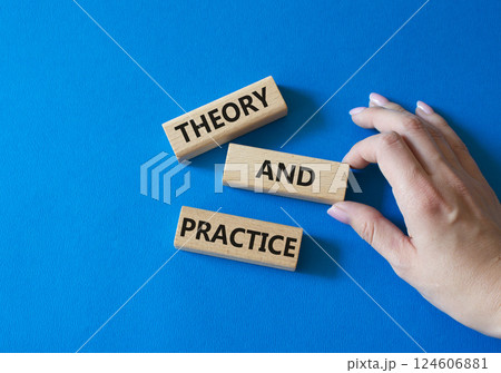 Theory and Practice symbol. Concept word Theory and Practice on wooden blocks. Businessman hand. Beautiful blue background. Business and Theory and Practice concept. Copy space Theory and Practice symbol. Concept word Theory and Practice on wooden blocks. Businessman hand. Beautiful blue background. Business and Theory and Practice concept. Copy space 124606881