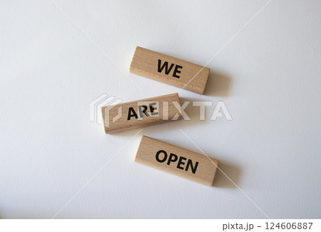 We are open symbol. Concept words We are open on wooden blocks. Beautiful white background. Business and We are open concept. Copy space We are open symbol. Concept words We are open on wooden blocks. Beautiful white background. Business and We are open concept. Copy space 124606887