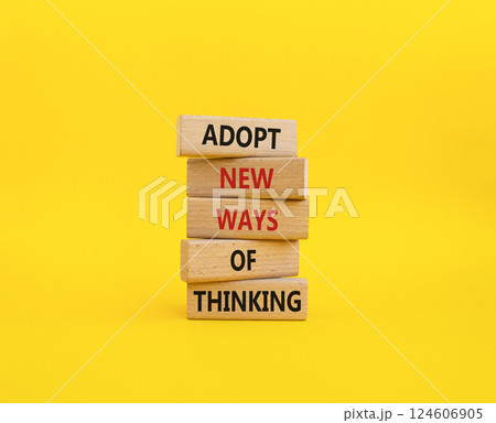 Adopt new ways of thinking symbol. Wooden blocks with words Adopt new ways of thinking. Beautiful yellow background. Business and Adopt new ways of thinking concept. Copy space. 124606905