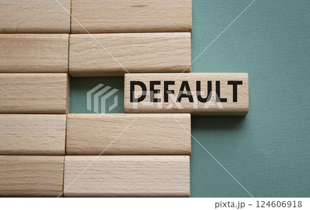 Default symbol. Concept word Default on wooden blocks. Beautiful grey green background. Business and Default concept. Copy space. Default symbol. Concept word Default on wooden blocks. Beautiful grey green background. Business and Default concept. Copy space. 124606918