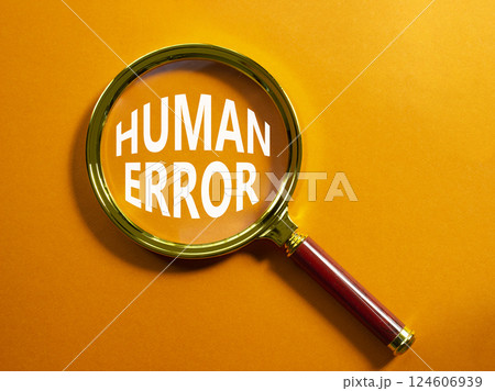 Human Error symbol. Magnifying glass with words Human Error. Beautiful orange background. Business and Human Error concept. Copy space. Human Error symbol. Magnifying glass with words Human Error. Beautiful orange background. Business and Human Error concept. Copy space. 124606939