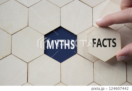 Facts or Myths symbol. Concept word Facts or Myths on wooden comb puzzle. Businessman hand. Beautiful deep blue background. Business and Facts or Myths concept. Copy space Facts or Myths symbol. Concept word Facts or Myths on wooden comb puzzle. Businessman hand. Beautiful deep blue background. Business and Facts or Myths concept. Copy space 124607442