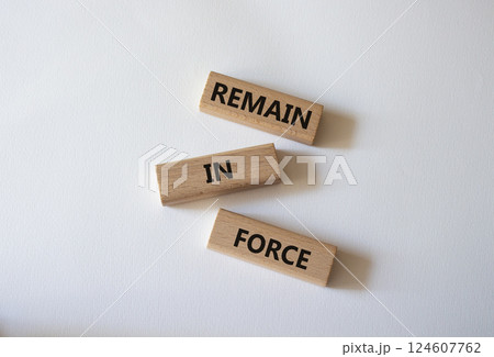 Remain in Force symbol. Concept words Remain in Force on wooden blocks. Beautiful white background. Business and Remain in Force concept. Copy space Remain in Force symbol. Concept words Remain in Force on wooden blocks. Beautiful white background. Business and Remain in Force concept. Copy space 124607762