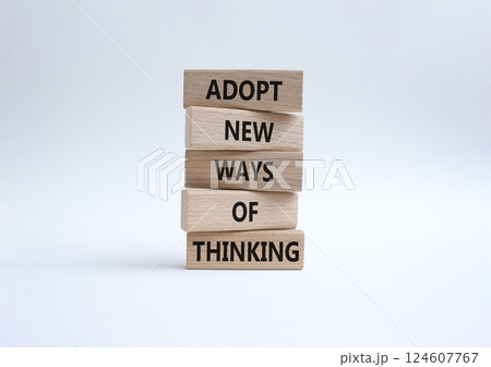 Adopt new ways of thinking symbol. Wooden blocks with words Adopt new ways of thinking. Beautiful white background. Business and Adopt new ways of thinking concept. Copy space. 124607767