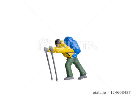 Miniature Figurine of a Trekker with Hiking Poles isolated on white background with clipping path Miniature Figurine of a Trekker with Hiking Poles isolated on white background with clipping path 124608487