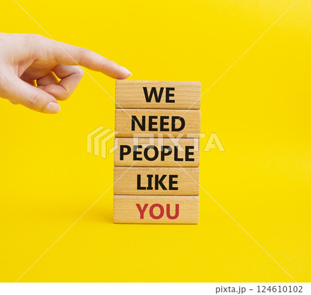 Hiring symbol. Wooden blocks with words We need People like You. Businessman hand. Beautiful yellow background. Business and Hiring concept. Copy space. 124610102