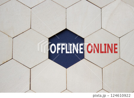 Offline or Online symbol. Concept word Offline or Online on wooden comb puzzle. Beautiful deep blue background. Business and Offline or Online concept. Copy space Offline or Online symbol. Concept word Offline or Online on wooden comb puzzle. Beautiful deep blue background. Business and Offline or Online concept. Copy space 124610922