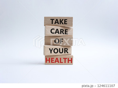 Health symbol. Wooden blocks with words Take Care of your Health. Beautiful white background. Health concept. Copy space. 124611107