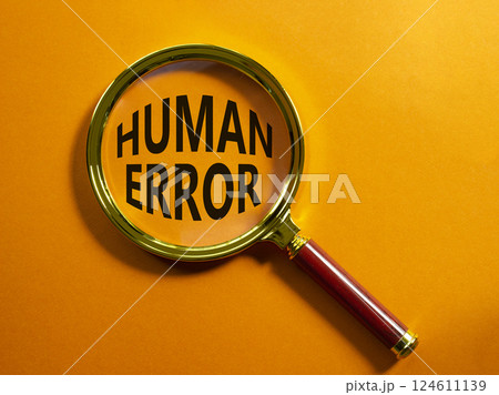 Human Error symbol. Magnifying glass with words Human Error. Beautiful orange background. Business and Human Error concept. Copy space. 124611139