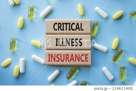 Critical Illness Insurance symbol. Concept word Critical Illness Insurance on wooden blocks. Beautiful blue background with pills. Medicine and Critical Illness Insurance concept. Copy space Critical Illness Insurance symbol. Concept word Critical Illness Insurance on wooden blocks. Beautiful blue background with pills. Medicine and Critical Illness Insurance concept. Copy space 124611488