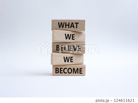 What we Believe we Become symbol. Concept words What we Believe we Become on wooden blocks. Beautiful white background. Business concept. Copy space. 124611621