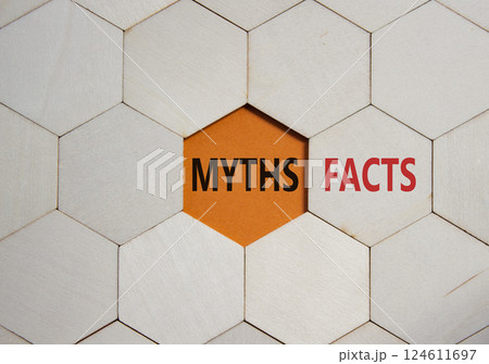 Facts or Myths symbol. Concept word Facts or Myths on wooden comb puzzle. Beautiful orange background. Business and Facts or Myths concept. Copy space Facts or Myths symbol. Concept word Facts or Myths on wooden comb puzzle. Beautiful orange background. Business and Facts or Myths concept. Copy space 124611697