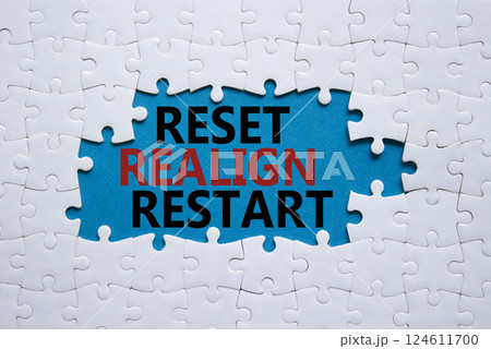 Reset Realign Restart symbol. Concept words Reset Realign Restart on white puzzle. Beautiful blue background. Business and Reset Realign Restart concept. Copy space. 124611700