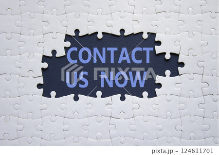 Contact us now symbol. White puzzle with words Contact us now. Beautiful deep blue background. Business and Contact us now concept. Copy space. Contact us now symbol. White puzzle with words Contact us now. Beautiful deep blue background. Business and Contact us now concept. Copy space. 124611701