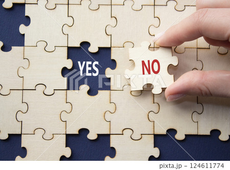 Yes or No symbol. Concept word Yes or No on wooden puzzle. Businessman hand. Beautiful deep blue background. Business and Yes or No concept. Copy space Yes or No symbol. Concept word Yes or No on wooden puzzle. Businessman hand. Beautiful deep blue background. Business and Yes or No concept. Copy space 124611774