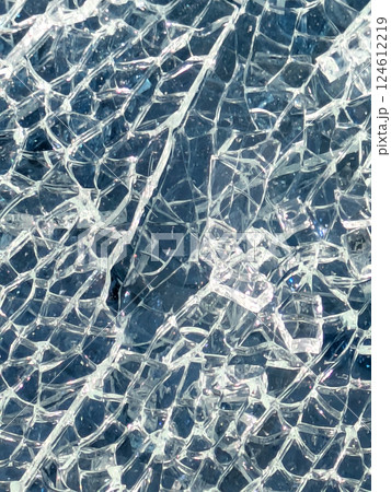 Close up od smashed glass abstract background splintered shards Close up od smashed glass abstract background splintered shards 124612219