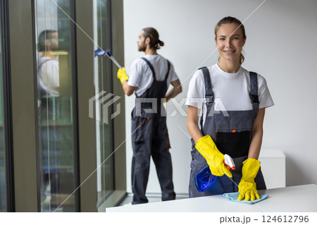 Group of young doing cleaning works in the office 124612796
