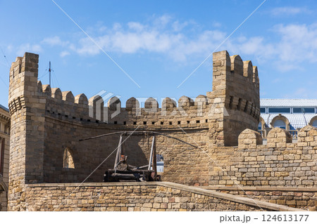 Historic fortress wall featuring a medieval catapult, Baku Historic fortress wall featuring a medieval catapult, Baku 124613177