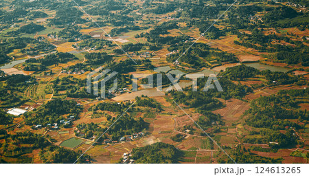 View From Airplane Window On Surroundings Of Chengdu, China. Development Of Agriculture In China. Wooded Terrain Landscape Of China. Porthole View Or Called Bull's-eye Window On Rice Fields. Discover 124613265
