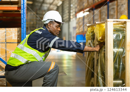 african black professional warehouse worker. stock inventory staff employee working in cargo storage african black professional warehouse worker. stock inventory staff employee working in cargo storage 124613344