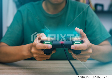 Close up hand playing game using joy game console a games gadget video technology object. Close up hand playing game using joy game console a games gadget video technology object. 124613745