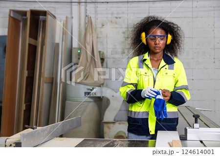 African black women worker working in wood workshop wooden furniture factory industry wearing groove African black women worker working in wood workshop wooden furniture factory industry wearing groove 124614001