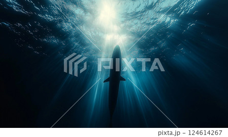 Silhouette of a nuclear submarine gliding silently through deep ocean waters under bright sunlight 124614267
