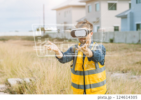 Engineer male worker using VR visual reality technology in construction industry with overly graphic 124614305