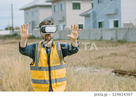 Engineer male worker using VR visual reality technology in construction industry. Engineer male worker using VR visual reality technology in construction industry. 124614307