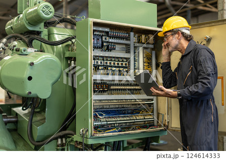 Senior Professional Electrician engineer service maintenance check electricity wire cable Senior Professional Electrician engineer service maintenance check electricity wire cable 124614333