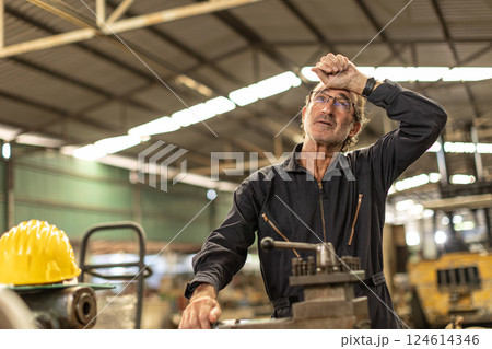 Senior worker tired exhausted headache pain suffer from hard work in heavy industry factory. 124614346