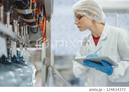 Industry inspector team working, QC staff work checking machine operation for safety and hygiene 124614372