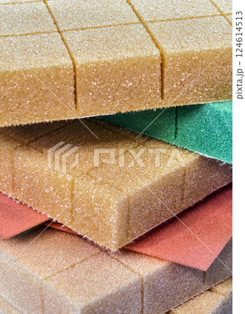 Close-up view of colorful foam rubber sheets stacked in layers for crafting and design projects Close-up view of colorful foam rubber sheets stacked in layers for crafting and design projects 124614513