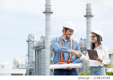 Professional Petroleum Refinery engineer team hand shaking together dealing oil gas building project Professional Petroleum Refinery engineer team hand shaking together dealing oil gas building project 124614598