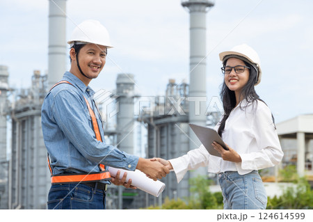 Professional Petroleum Refinery engineer team hand shaking together dealing oil gas building project Professional Petroleum Refinery engineer team hand shaking together dealing oil gas building project 124614599