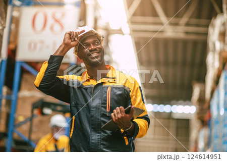 African black worker male working in warehouse happy smiling smart confident professional look African black worker male working in warehouse happy smiling smart confident professional look 124614951
