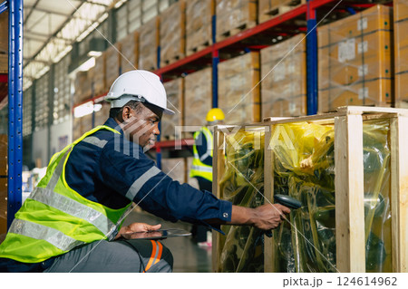 african black professional warehouse worker. stock inventory staff employee working in cargo storage 124614962
