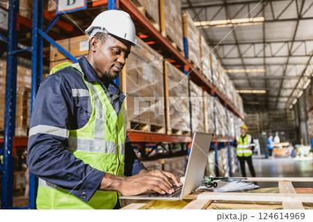 african black professional warehouse worker. stock inventory staff using computer check stock online african black professional warehouse worker. stock inventory staff using computer check stock online 124614969