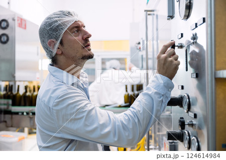 professional engineer technician man service check machine in drink factory for quality standard 124614984