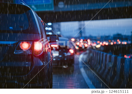 Traffic jam in evening with storm raining. people stuck on heavy traffic wet rain road in Bangkok Traffic jam in evening with storm raining. people stuck on heavy traffic wet rain road in Bangkok 124615111