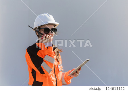 Engineer technician worker checking service maintenance wind turbine clean electricity power station 124615122