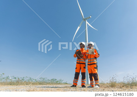 Engineer workers teamwork working together service maintenance wind turbine clean power green energy Engineer workers teamwork working together service maintenance wind turbine clean power green energy 124615180