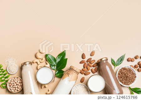 Vegan plant based milk bottles and ingredients. Substitute drink 124615766