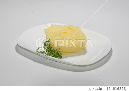 Creamy Mashed Potatoes Garnished with Fresh Dill on White Ceramic Plate Creamy Mashed Potatoes Garnished with Fresh Dill on White Ceramic Plate 124616228