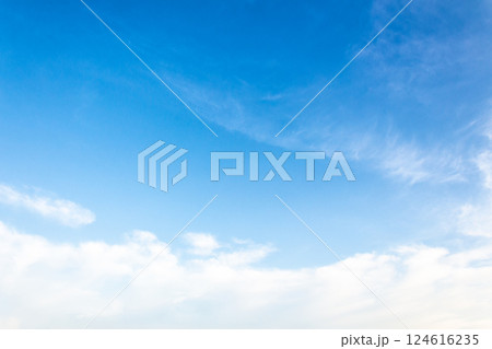 nature backdrop with blue sky and white fluffy clouds in morning light. bright and sunny weather forecast background 124616235