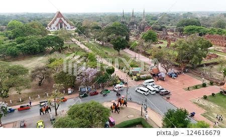 Tourists ride an elephant through the streets of Ayutthaya cultural. 124616679