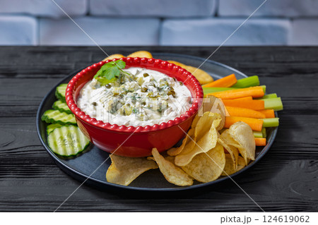 creamy yogurt pickles caper dill dip in red bowl 124619062