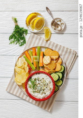 creamy yogurt pickles caper dill dip in red bowl 124619067